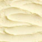 Smooth vanilla keto ice cream close-up with visible bean flecks—highlighting creamy texture.